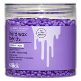 Sliick Acai Berry hard wax beads in jar, gentle on sensitive skin for at-home face and body waxing.
