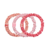 SLIP Skinny Scrunchies peach with gentle crease-free hold for delicate hair.