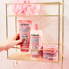 Fragrance swirls in Soap & Glory Original Pink Scrub jar with bergamot and rose notes.