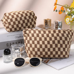 SOIDRAM brown checkered makeup bag, travel-ready and easy to reach in a purse or suitcase.
