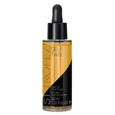 St.Tropez Luxe Tan Tonic Glow Drops bottle close-up showing natural tanning actives for a customizable tan