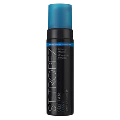 St.Tropez Self Tan Dark Bronzing Mousse application for an even natural glow.