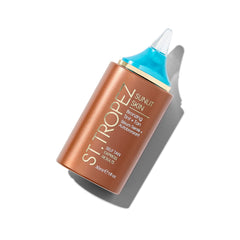 St.Tropez Sunlit Skin bottle closeup showing quick-drying bronzer for instant glow