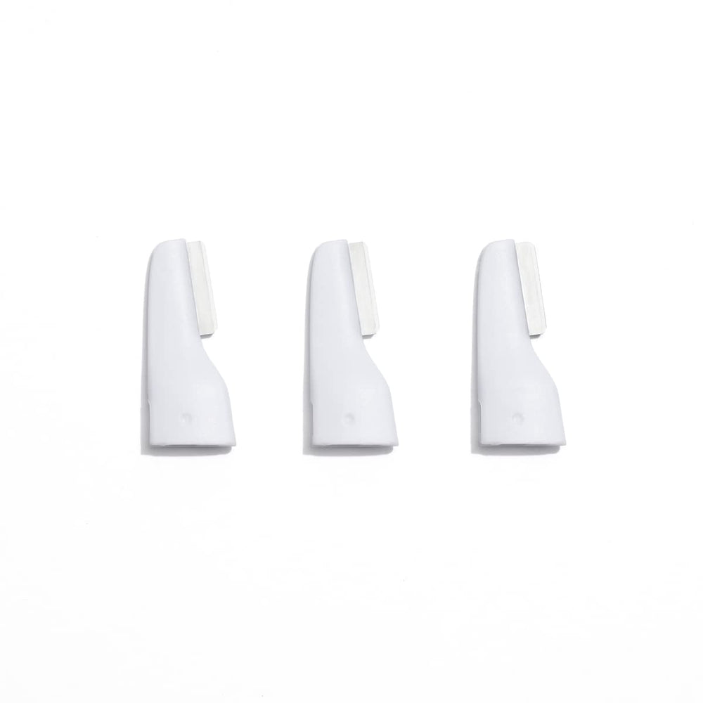 StackedSkincare mini precision dermaplaning blade focused on the nose for targeted exfoliation.