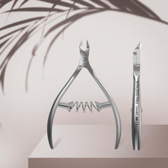 Staleks Pro Cuticle Trimmer matte finish reduces glare during professional use.