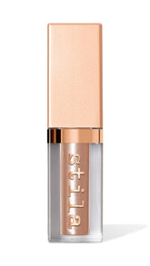 Stila Shimmer and Glow Original bottle closeup highlighting shimmering liquid shadow texture