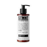 STMNT Acondicionador, botella visible; hidratación suave para cabello y barba.