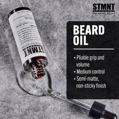 Close-up of STMNT beard oil label highlighting silicone-free formula.