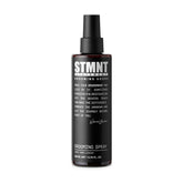 STMNT Grooming Spray in a 6.7 oz bottle for easy styling and light hold.