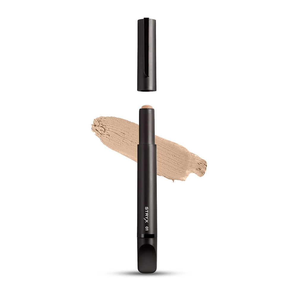 Stryx Concealer Tool in light cognac shade applied for quick blemish coverage