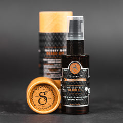 Suavecito Premium Blends Beard Oil label shows cedarwood and patchouli scent.