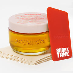 SUGARDOH jar and applicator for easy at-home waxing.