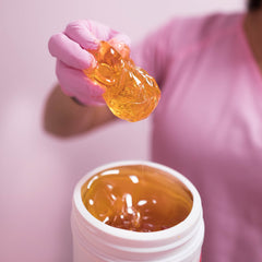 Sugaring NYC paste legs image highlights smooth legs after treatment