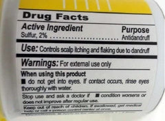 Close-up of SULFUR8 conditioner texture highlighting hydration for smooth hair.