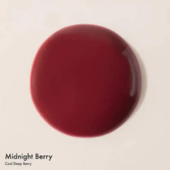 Dream Lip Oil Midnight Berry swatches on arm reveal rich tint and moisture.