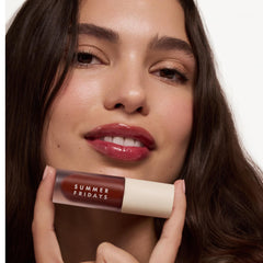 Midnight Berry swatch on lips shows vibrant color and lasting hydration.
