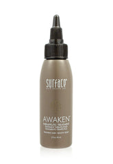 Surface Awaken Therapeutic Treatment bottle on shelf promotes scalp nourishment.