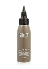 Surface Awaken Therapeutic Treatment bottle on shelf promotes scalp nourishment.