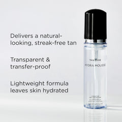 Tan-Luxe Hydra Mousse applied with mitt for even circular application.