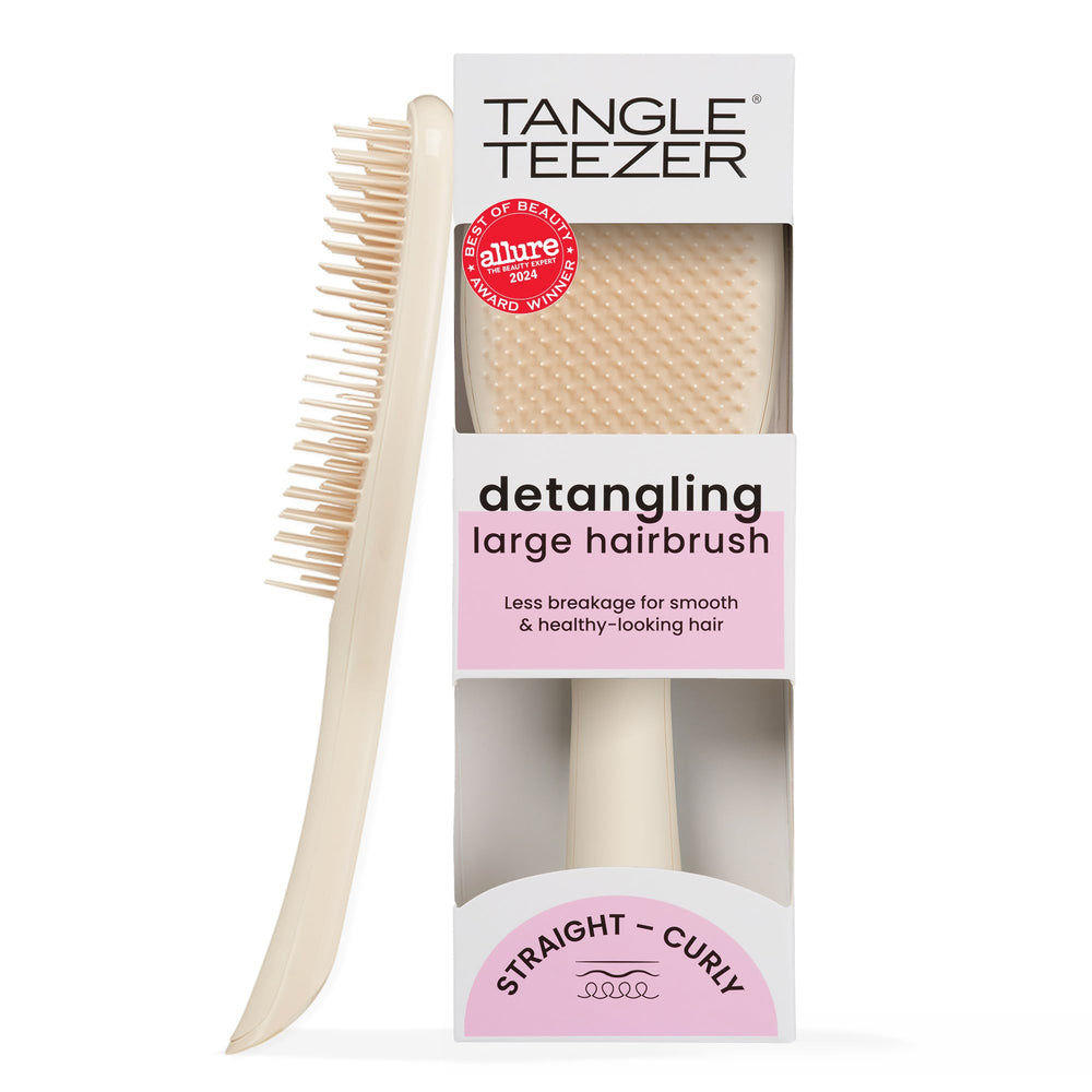 Tangle Teezer Ultimate Detangler with large paddle for gentle knot-free detangling on long hair.