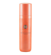 TATCHA Brightening Serum bottle close-up showing glow from vitamin C