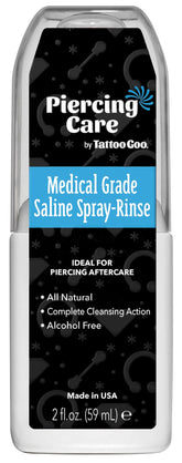 Tattoo Goo saline spray bottle pour demonstrates gentle cleansing for new piercings and supports healing.