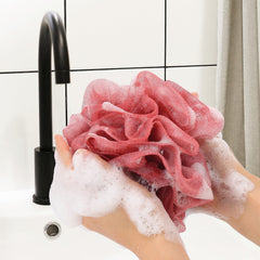 Esponja de baño Tbestmax azul con malla, ideal para generar espuma abundante.
