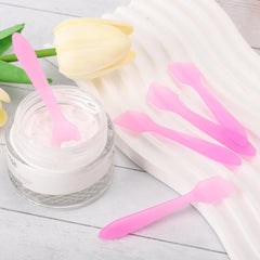 Tbestmax spatula for facial masks shown beside jar