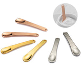 Tekson rose gold spatula set for precise, hygienic application.
