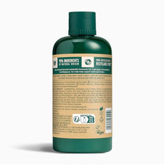 The Body Shop Ginger Scalp Care Shampoo, textura sedosa vegana para cabello saludable.