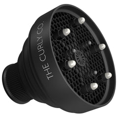 The Curly Co collapsible diffuser attached to a standard dryer for even airflow.