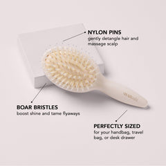 The Hair Edit brush with boar bristles and nylon pins distributing natural oils