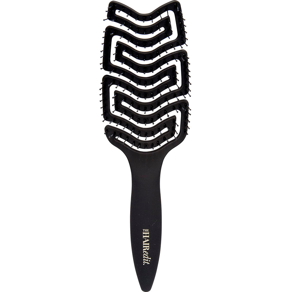 The Hair Edit detangle brush glides through wet hair for gentle detangling.