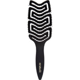 The Hair Edit detangle brush glides through wet hair for gentle detangling.