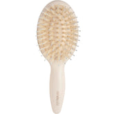 The Hair Edit mini brush close-up showing boar bristles for gentle detangling