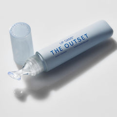 The Outset Lip Oasis glossy application swatch shows a smooth, non-sticky shine.