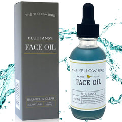 The Yellow Bird Balancing Blue Tansy face oil bottle close-up for radiant, balanced skin support.