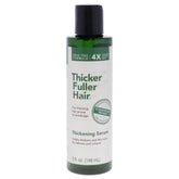 Thicker Fuller Hair thickening serum bottle close-up promotes fuller-looking hair and stronger strands.