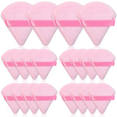 Thrilez pink triangle powder puff for precise powder placement on the face.