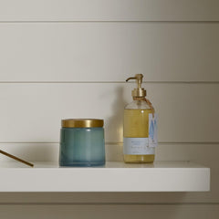 Thymes Hand Wash Washed Linen bottle on bathroom counter, inviting a calm routine.