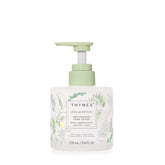 Thymes replenishing hand lotion bottle in an elegant glass container for daily moisture.