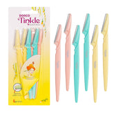 Tinkle dermaplaning tool close-up blade for precise facial hair removal.