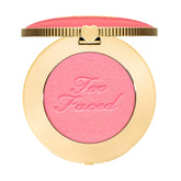 Too Faced Cloud Crush Blurring Blush bottle close-up showing soft, cloud-like blush texture for natural-looking color.