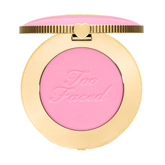 Too Faced Cloud Crush Blurring Blush compact shows airy, diffused color on cheeks.
