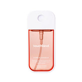 Touchland Peachy Lychee bottle showing a refreshing fragrance for body and hair.