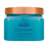 Tree Hut Blue Musk Sugar Scrub envase de 18 onzas para exfoliar e hidratar la piel.