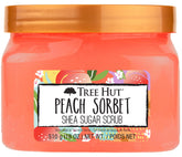 Tree Hut Peach Sorbet exfoliante muestra la botella vertiendo para exfoliar suavemente la piel
