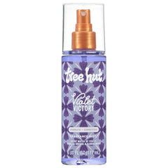 Tree Hut Violet Victory fragrance mist bottle on vanity, offering hydration and a calming scent.