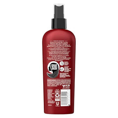 TRESemmé Heat Protection Spray mist applied to hair to guard against heat.