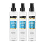 TRESemmé Pro Pure Leave-In Conditioner trio bottles on bathroom counter for detangling and smooth results.